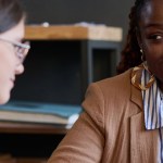 A social worker meeting with a client