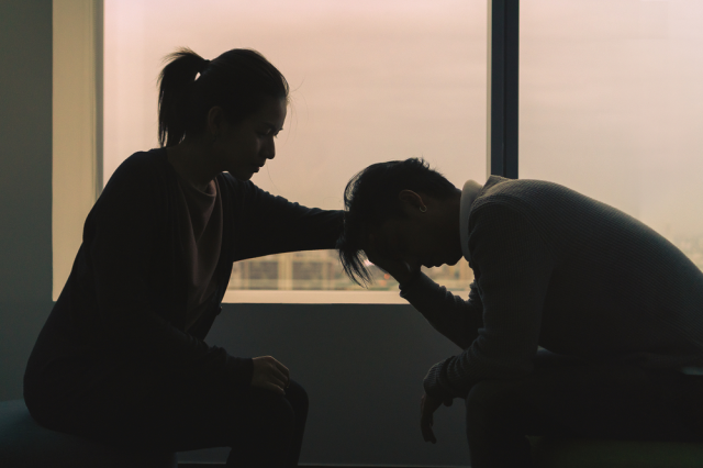 Woman consoling another person