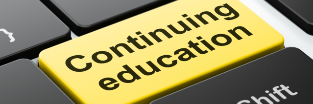 Closeup of a yellow keyboard button that says Continuing Education