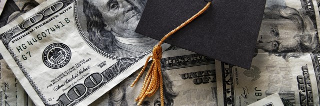 Graduation cap on top of U.S. $100 bill