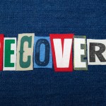 RECOVERY text word collage, colorful fabric on blue denim, rehabilitation and recovery, horizontal aspect